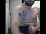 Bearded and tattoed guy showing his cock again