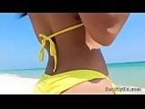 Huge tits Latina in bikini at beach